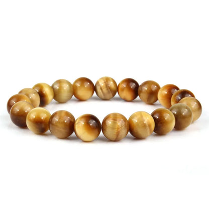 Natural tiger eye crystal bead bracelet showing round geometric beads on a wrist, available in multiple sizes and colour variations.