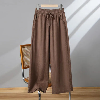 Women's apricot straight-leg casual trousers with elastic waist and drawstring lace-up detail.