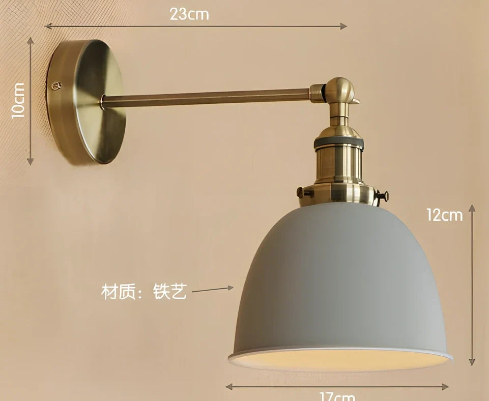 Bedroom wall light with 15cm wide iron shade in pink colour, mounted 20cm projection for soft illumination