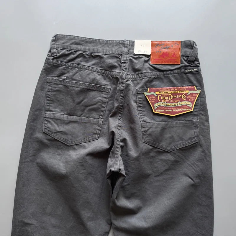 Men's casual trousers in American retro straight fit design, constructed from cotton fabric with mid waist and standard trousers length, available in grey, army green, and khaki solid colours across eight waist sizes from 29 to 38 inches.