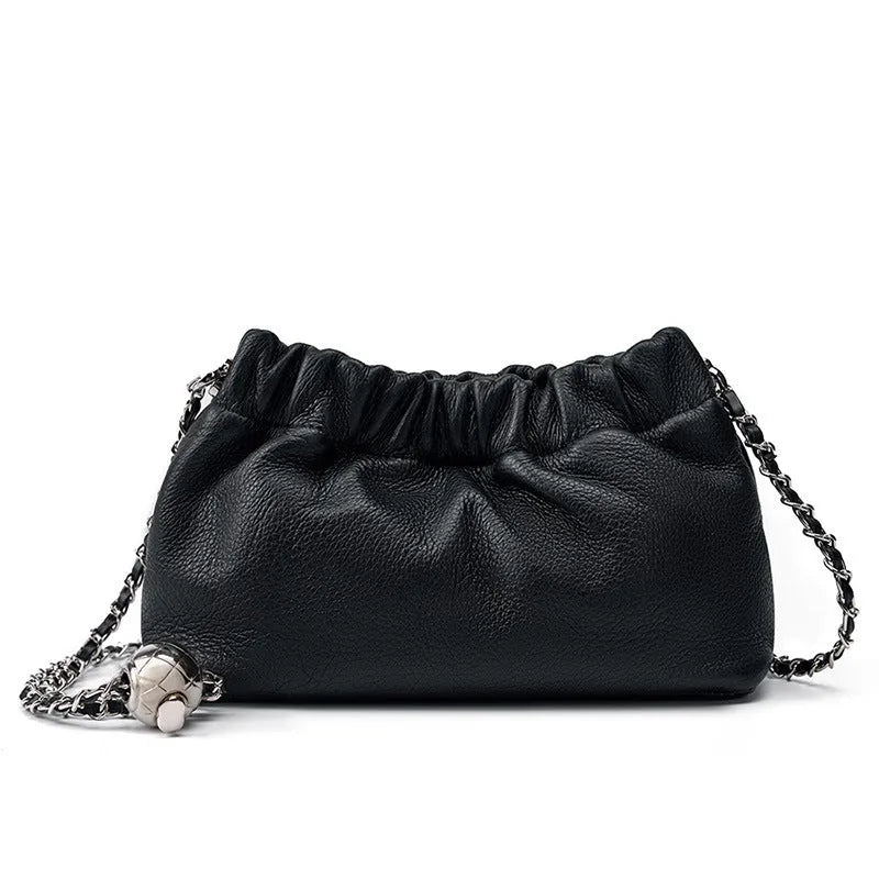 Women's dumpling-shaped genuine leather crossbody bag in three neutral colours showing slit pocket