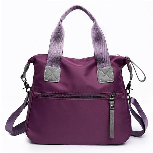 A fashionable and versatile ladies tote bag with multiple compartments and carrying options for the modern woman on the move.