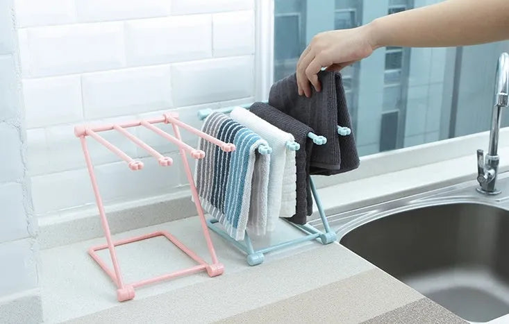 Foldable dishcloth shelf kitchen accessories gadget organiser rack for storage, made from plastic in a Nordic style, measuring 20cm x 16cm x 25cm x 16cm, with a punch-free installation method and available in light pink, light blue, and light grey.