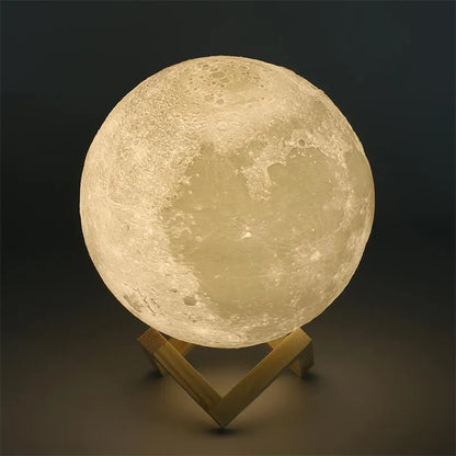 3D printed white moon lamp on a wooden holder, showing detailed crater texture and soft LED glow.