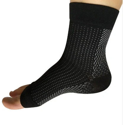 Anti-fatigue compression foot sleeve in black, red, or white, featuring moisture-wicking fabric and a heel hole for breathability.
