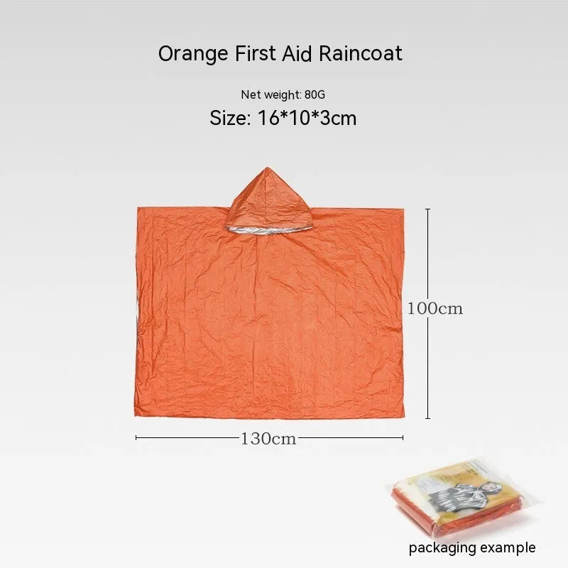 Orange emergency tent with sleeping bag and blanket disaster relief kit on ground