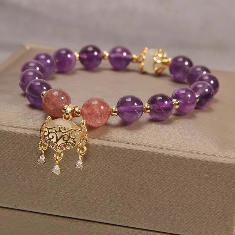 Copper longevity lock bracelet for women with drop-shaped charm, Ruyi and safety lock symbols.