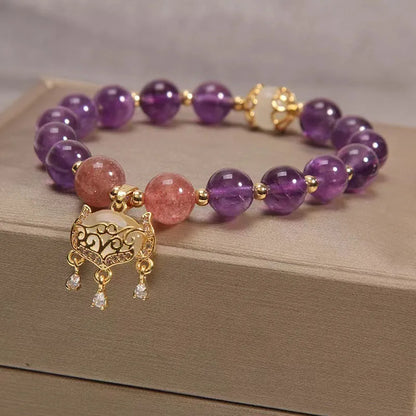 Copper longevity lock bracelet for women with drop-shaped charm, Ruyi and safety lock symbols.