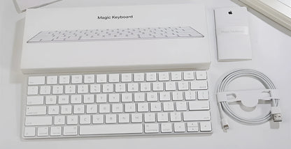 White Apple G6 ultra-thin metal Bluetooth wireless keyboard on a desk.
