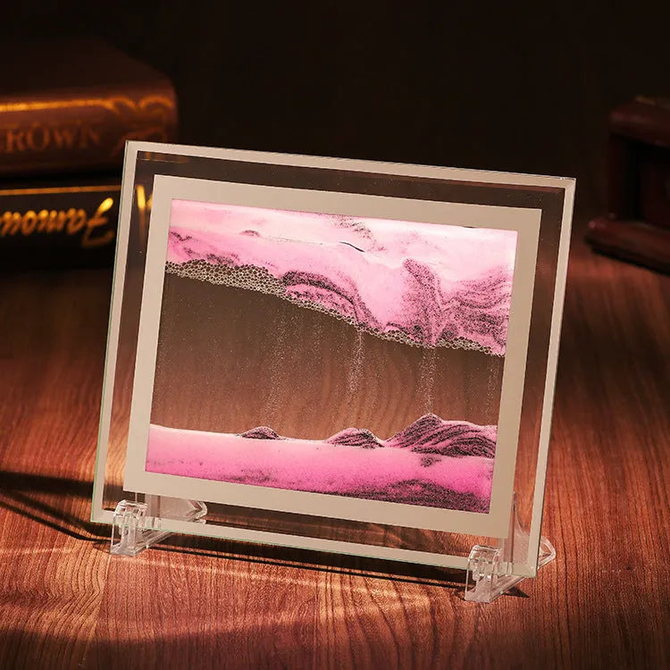 Geometric glass ornament containing a colourful quicksand landscape painting in modern style.