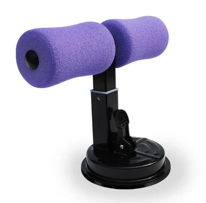 Compact sit-up strength trainer with steel springs and foam padding for home fitness