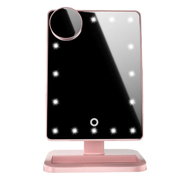 Pink touch screen makeup mirror with LED lights and Bluetooth speaker showing 10X magnification section