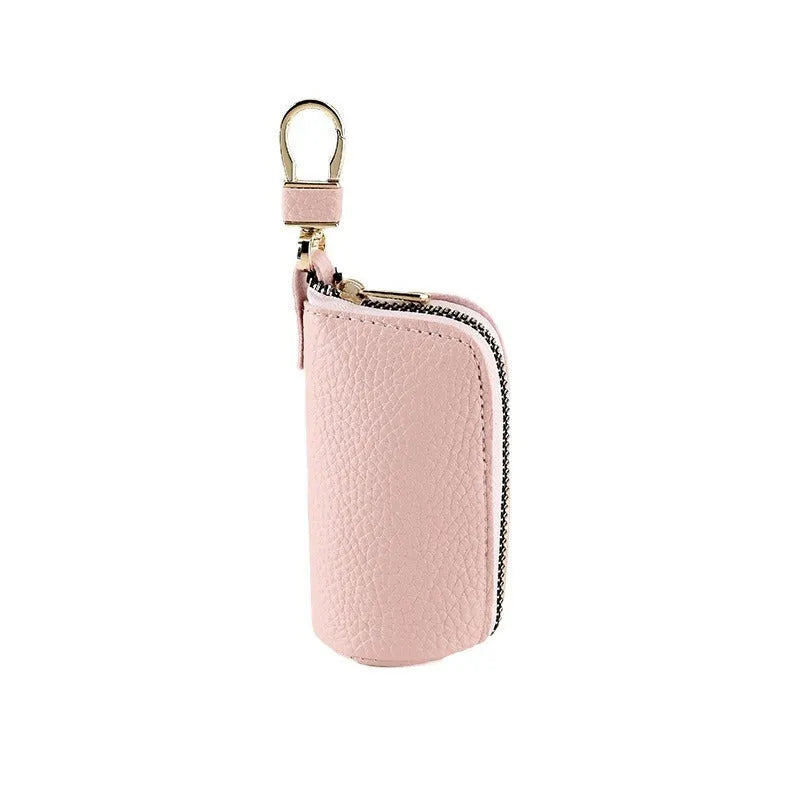 Minimalist black PU leather key wallet with a silver metal zipper closure.