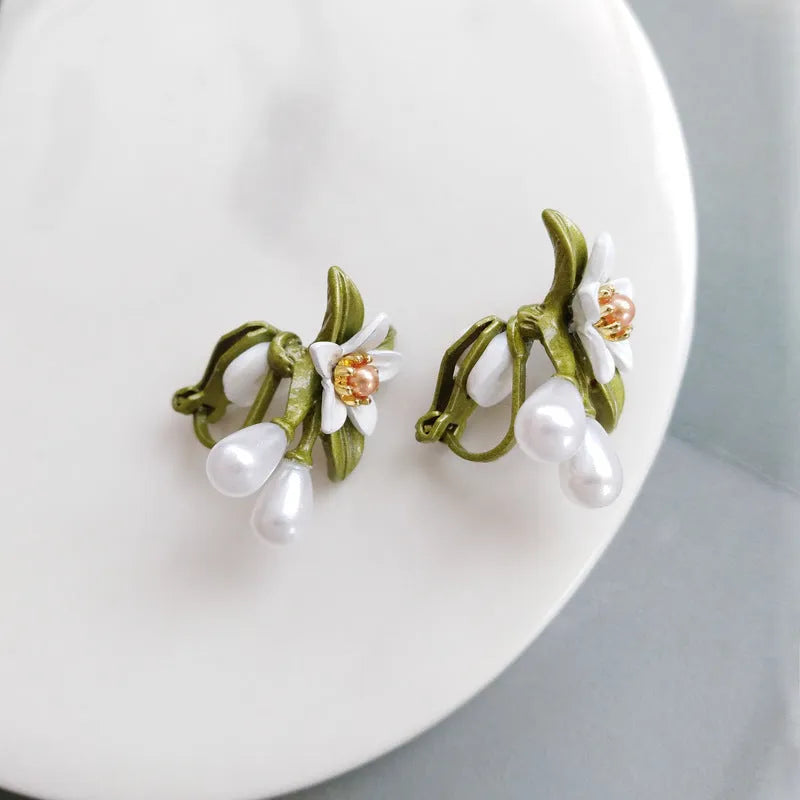 Alloy flower earring set with sterling silver needle detailing showing both stud and clip styles