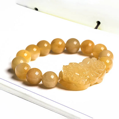 Carved jinsi jade money bracelet in golden thread colour with jade bead detailing