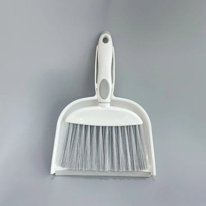 Small plastic handheld dustpan and brush cleaning kit in assorted colours.