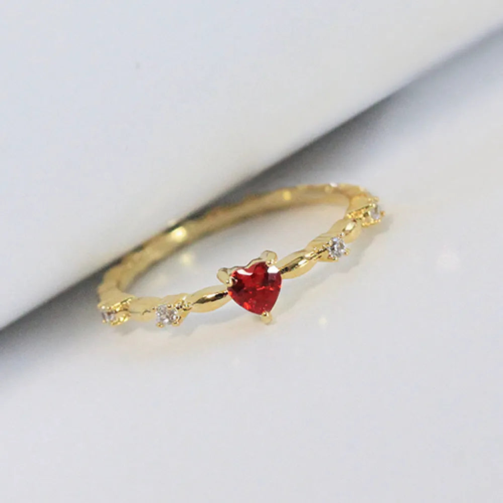 Gold and silver tone peach heart ring with zircon decoration, shown in sizes 6-10