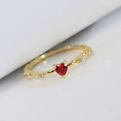 Gold and silver tone peach heart ring with zircon decoration, shown in sizes 6-10