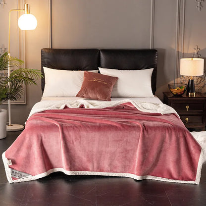A thick, plain coral fleece blanket in a choice of colours, folded to show its texture.