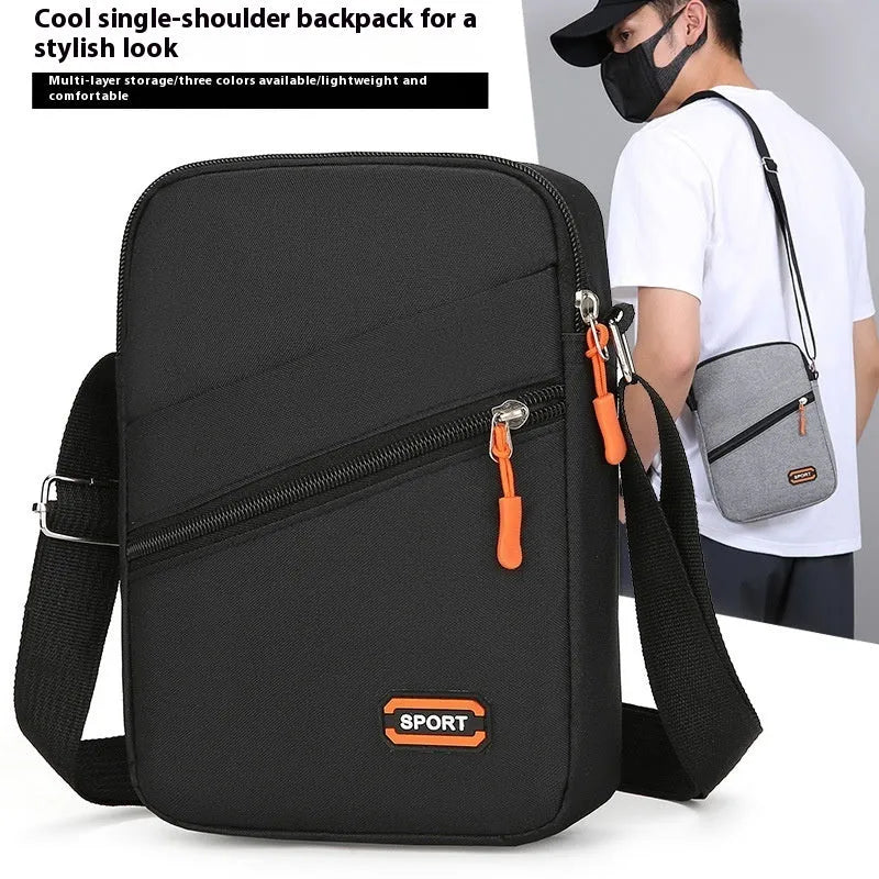 Ultra-light Oxford cloth commuter crossbody bag in solid colour with contrast stitching.