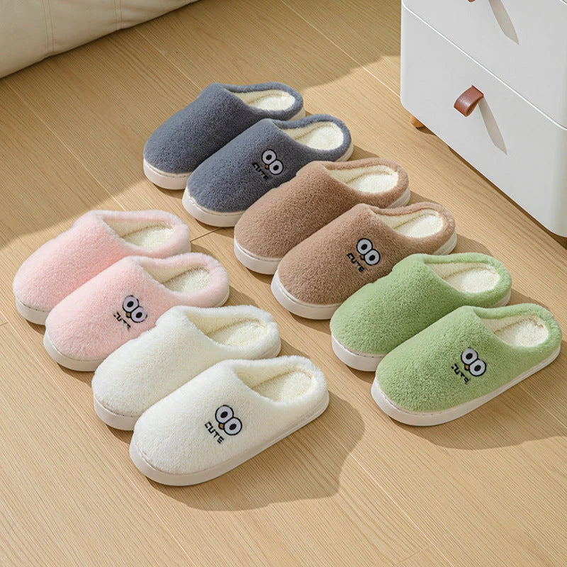 Stylish and cozy cartoon-inspired slippers with plush material and non-slip rubber soles, perfect for keeping feet warm and comfortable at home.