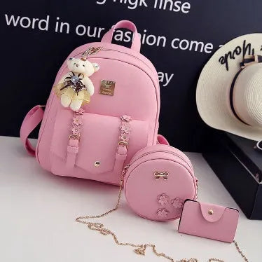 Women's black PU leather backpack, shoulder bag, and card bag set with flower designs.