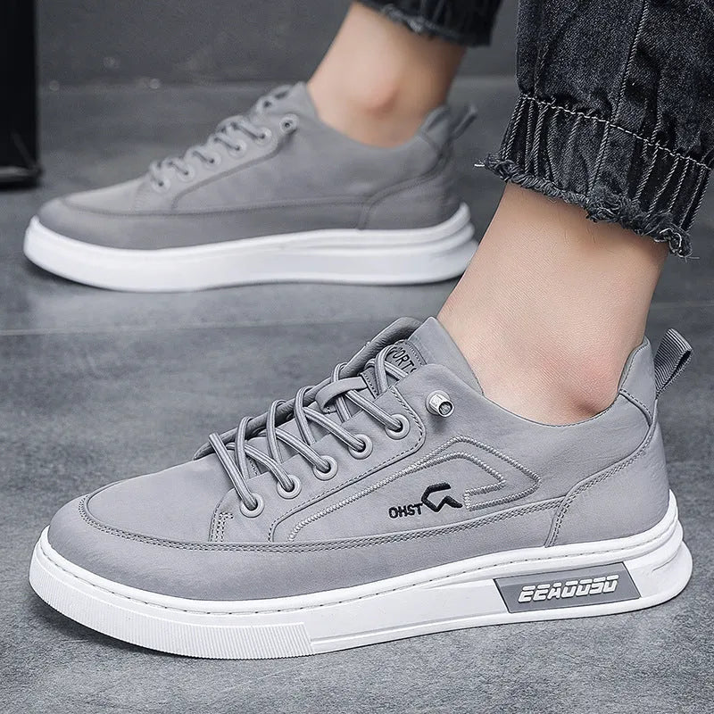 Gray men's canvas casual shoes with ice silk construction, leather lining, and rubber sole in low top design