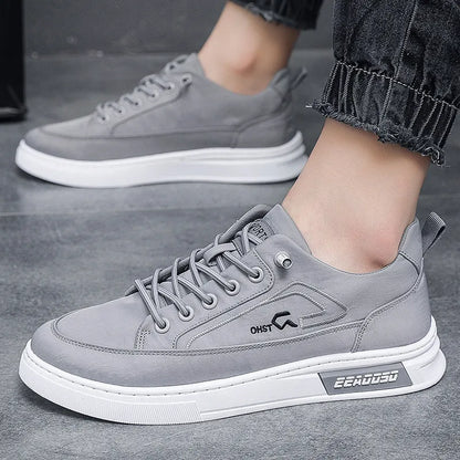 Gray men's canvas casual shoes with ice silk construction, leather lining, and rubber sole in low top design