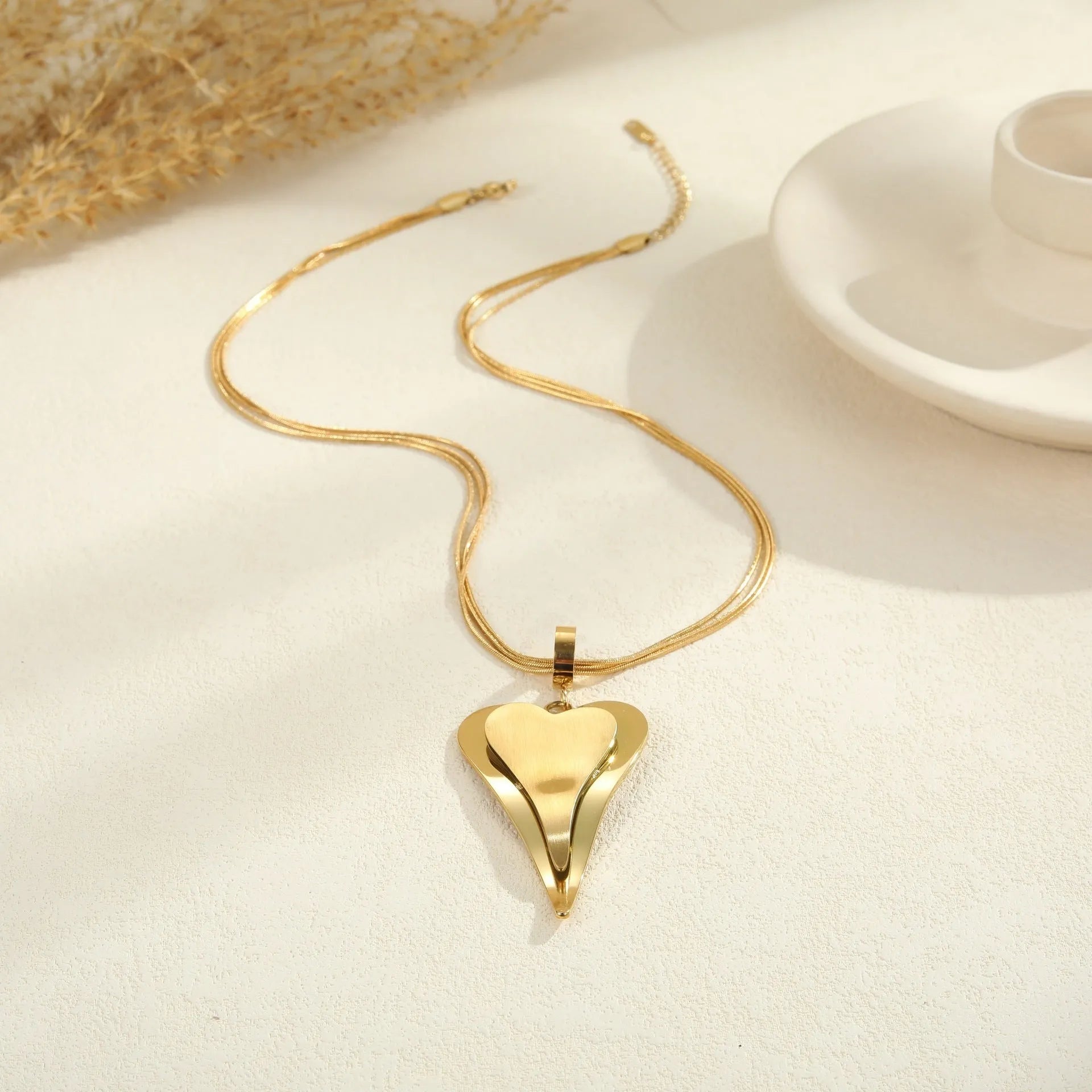 Stainless steel geometric necklace with double heart snake bones pendant in gold or steel colour