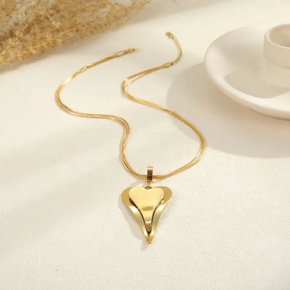 Stainless steel geometric necklace with double heart snake bones pendant in gold or steel colour