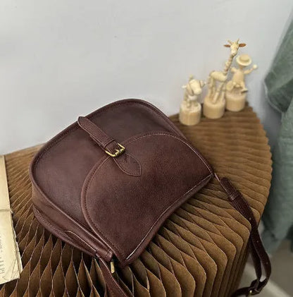 Genuine leather retro messenger bag with crossbody strap and flap closure in coffee colour