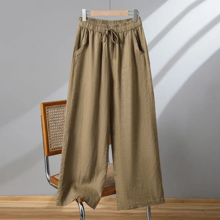Women's apricot straight-leg casual trousers with elastic waist and drawstring lace-up detail.