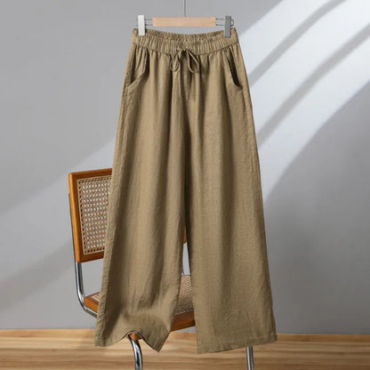 Women's apricot straight-leg casual trousers with elastic waist and drawstring lace-up detail.