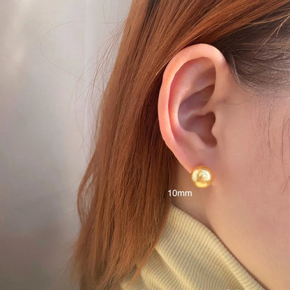 Geometric eight-point star pearl stud earrings in silver with cultured pearls, showing post-and-clasp fastening