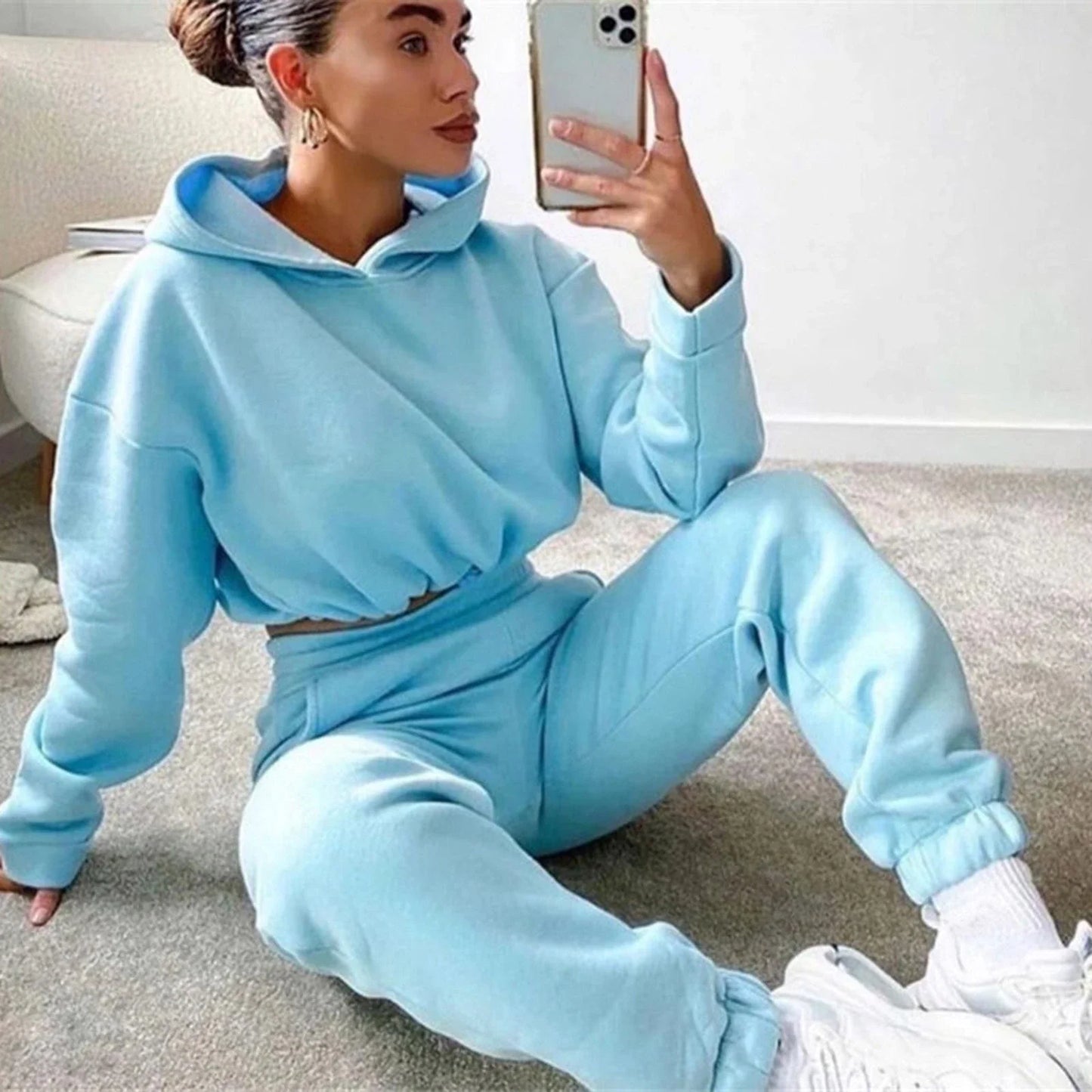 Stylish 2-piece athleisure sets for women in a variety of vibrant colors, including pink, purple, black, blue, and more.