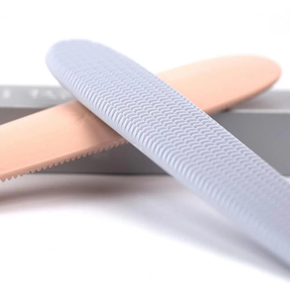 Grey and pink ABS plastic cat grooming comb with tongue-like texture and dual-ended design