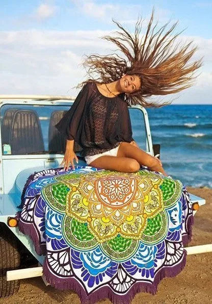 Round floor mat with polygon print and tassel trim, shown in available colours.