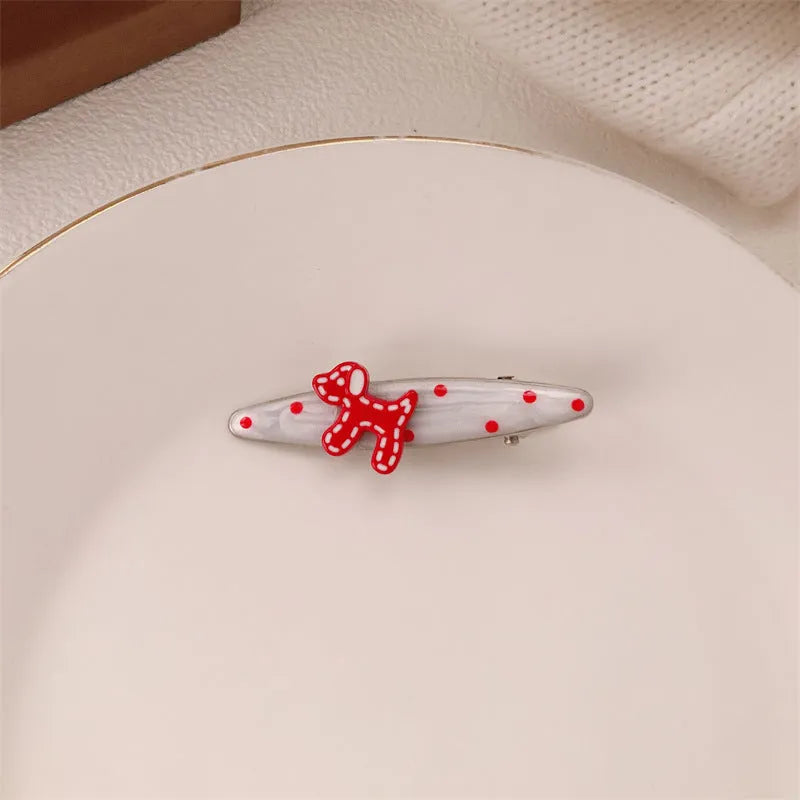 Red love heart-shaped hair barrette clip with retro white dots on a willow leaf-shaped base.