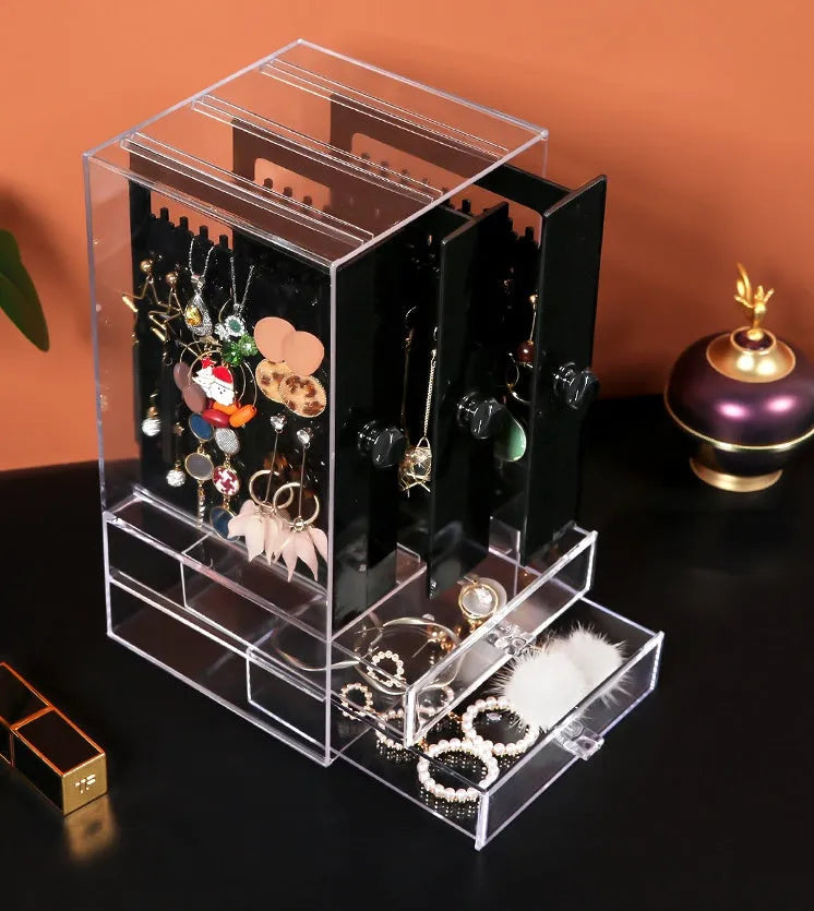 Clear acrylic cosmetic storage box showing makeup organisation with dimensions 13.5x13x24.7 cm