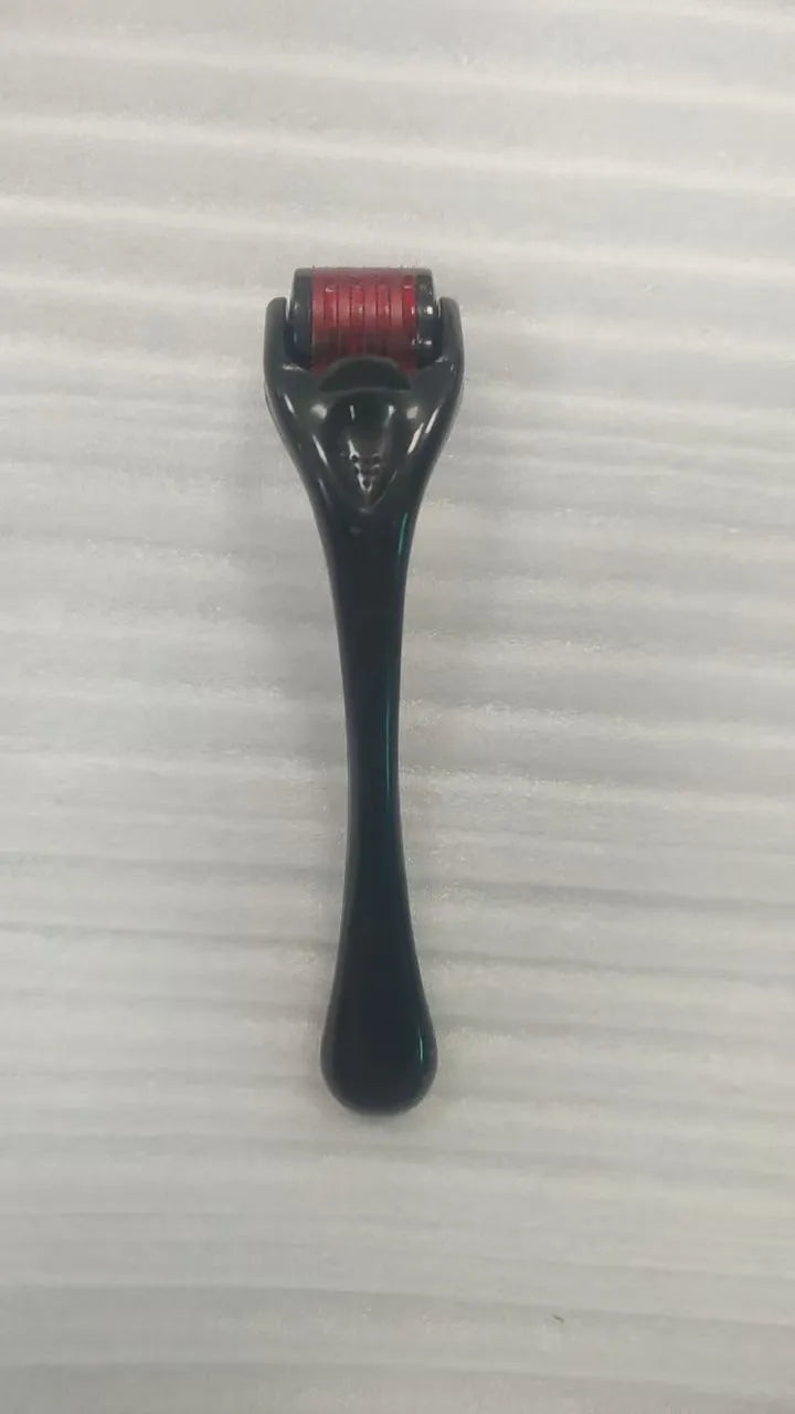 Sterile micro needle derma roller with black handle and coloured wheel on white background