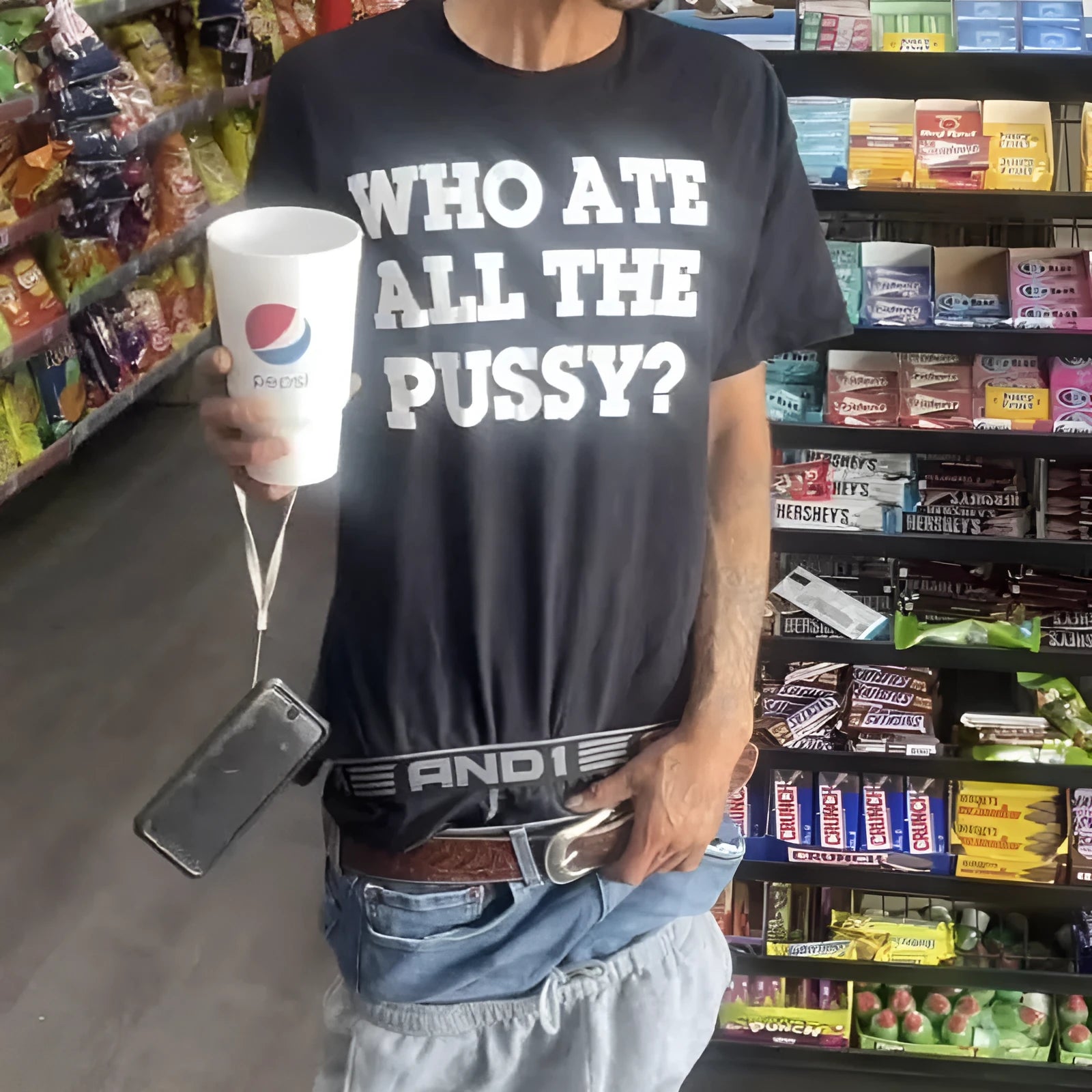 Man modelling a black loose-fit heavy cotton retro t-shirt with short sleeves.