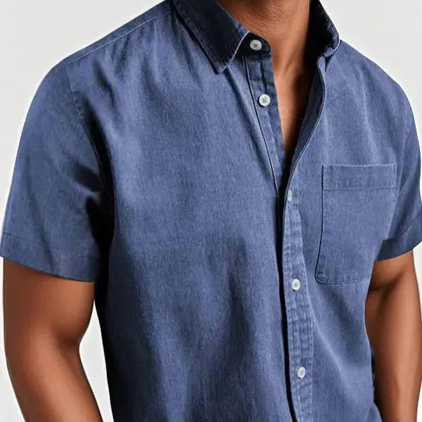 Man wearing a grey loose-fit short sleeve cardigan style shirt