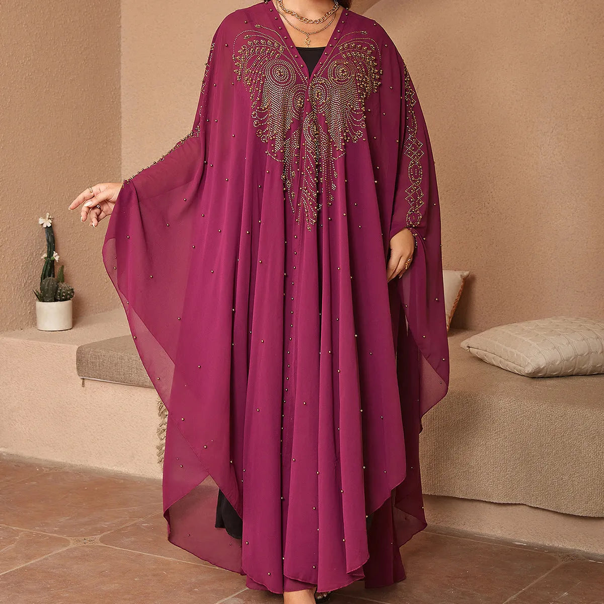 Purple chiffon Muslim style shawl with rhinestone beaded trim laid flat showing its long length.
