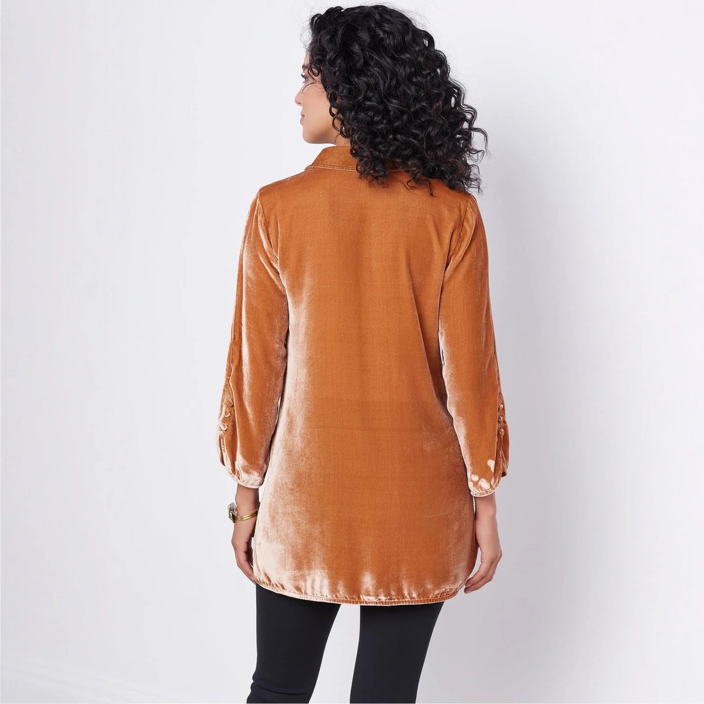 Gold velvet bell sleeve shirt with lapel slit button front showing loose fit and flared cuffs
