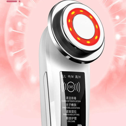 Pink and white facial massager with light therapy and pore cleansing features