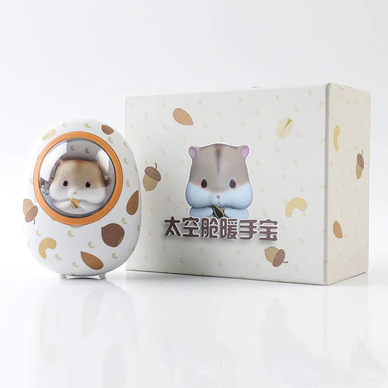 White Hamster space capsule design hand warmer and 5000mAh USB power bank unit.
