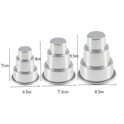 Set of three silver aluminium alloy cake moulds in large, medium, and small sizes.