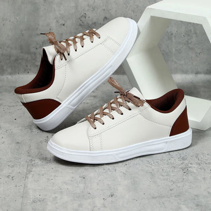 Casual beige brown platform skateboard sneakers with a low-top PU upper, round toe, and cross-strap detail