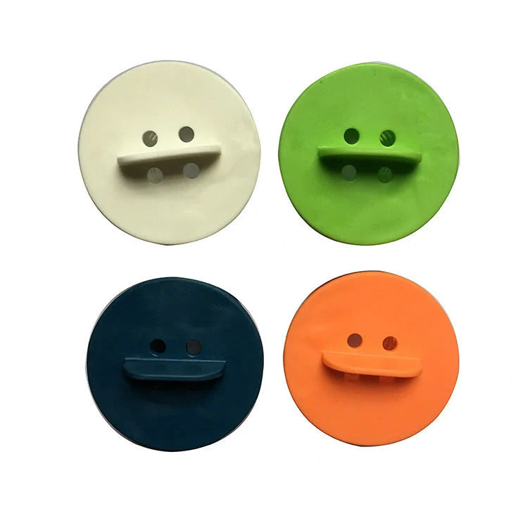 Anti-clogging plastic sink filter in blue, green, orange, and white