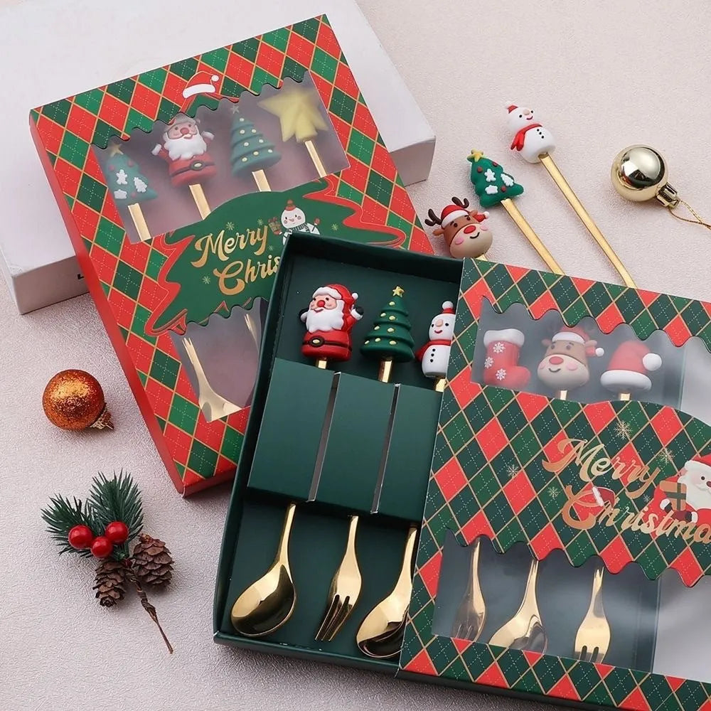 Red-handled stainless steel Christmas spoons and forks with snowman and tree designs.